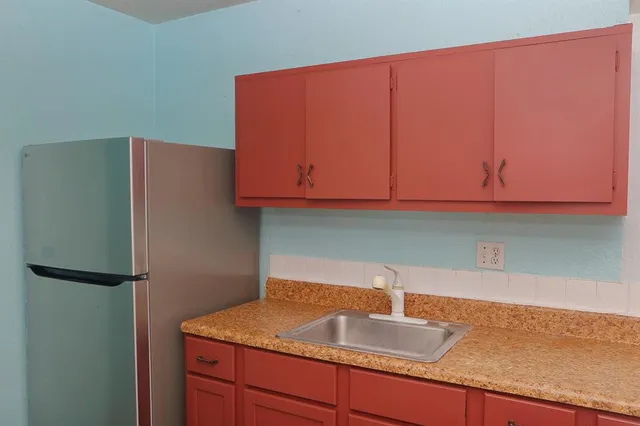 a bathroom with a sink a toilet and bathtub