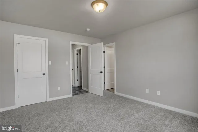 a bathroom with a shower and toilet