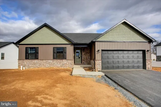 a view of house with yard outdoor space and seating area