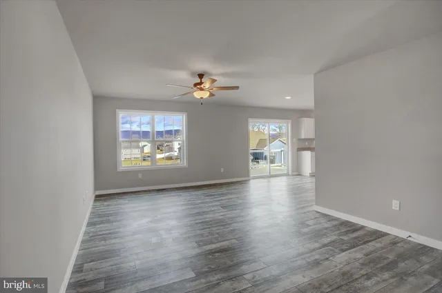 a view of a kitchen with a sink and a stove top oven