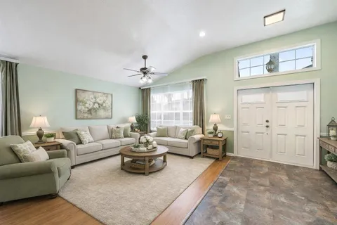 a living room with furniture and a large window