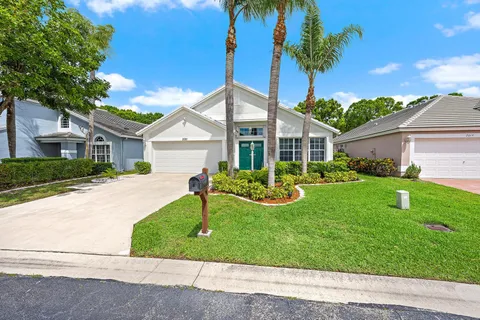 a front view of a house with a yard and porch