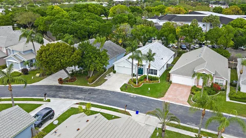 an aerial view of a house with a swimming pool