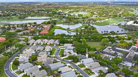 an aerial view of residential houses with outdoor space