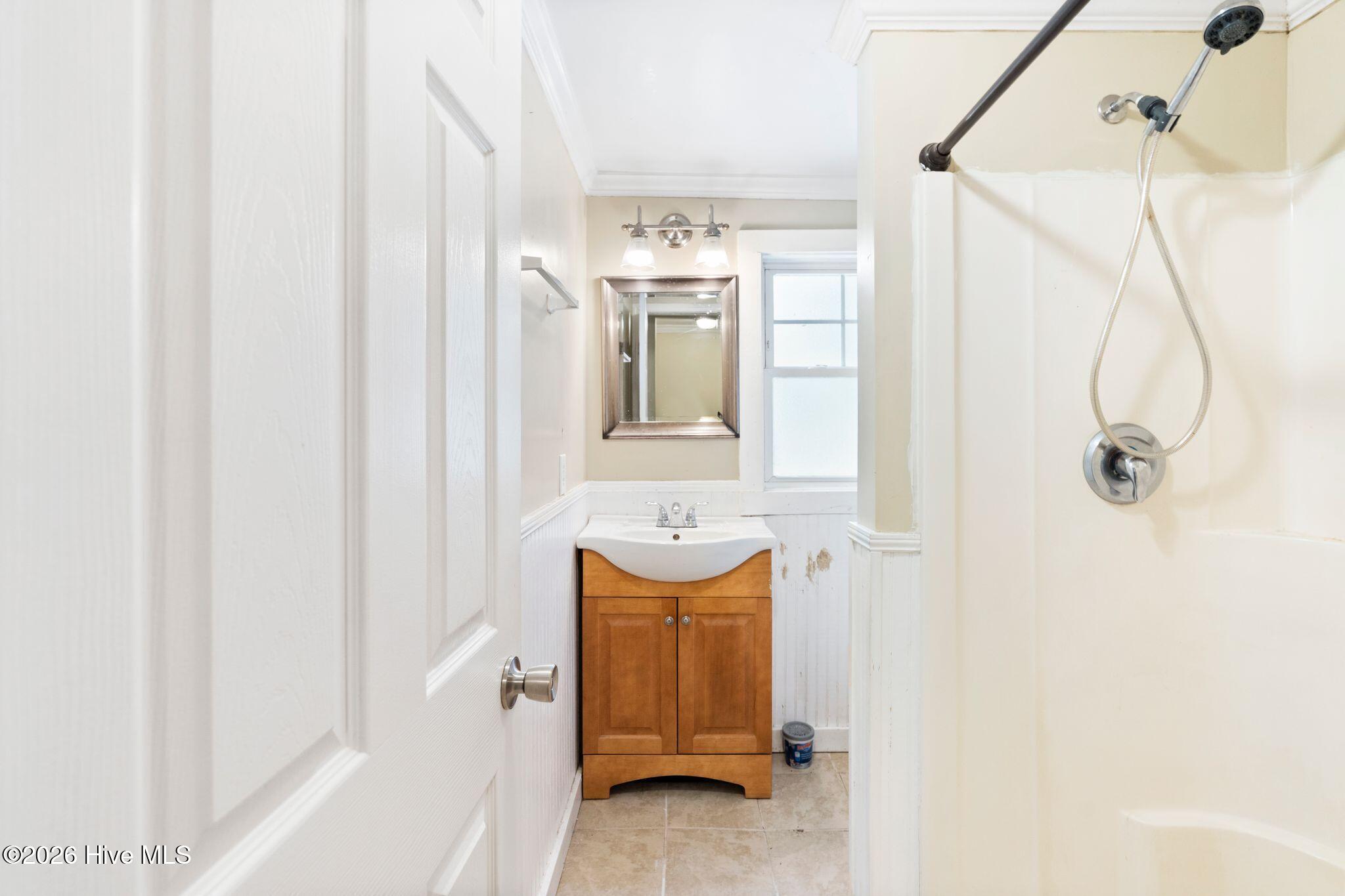 2715 Castle Hayne Road Wilmington, NC 28401 - Photo 22 of 35 Commode behind shower near window, not pictured