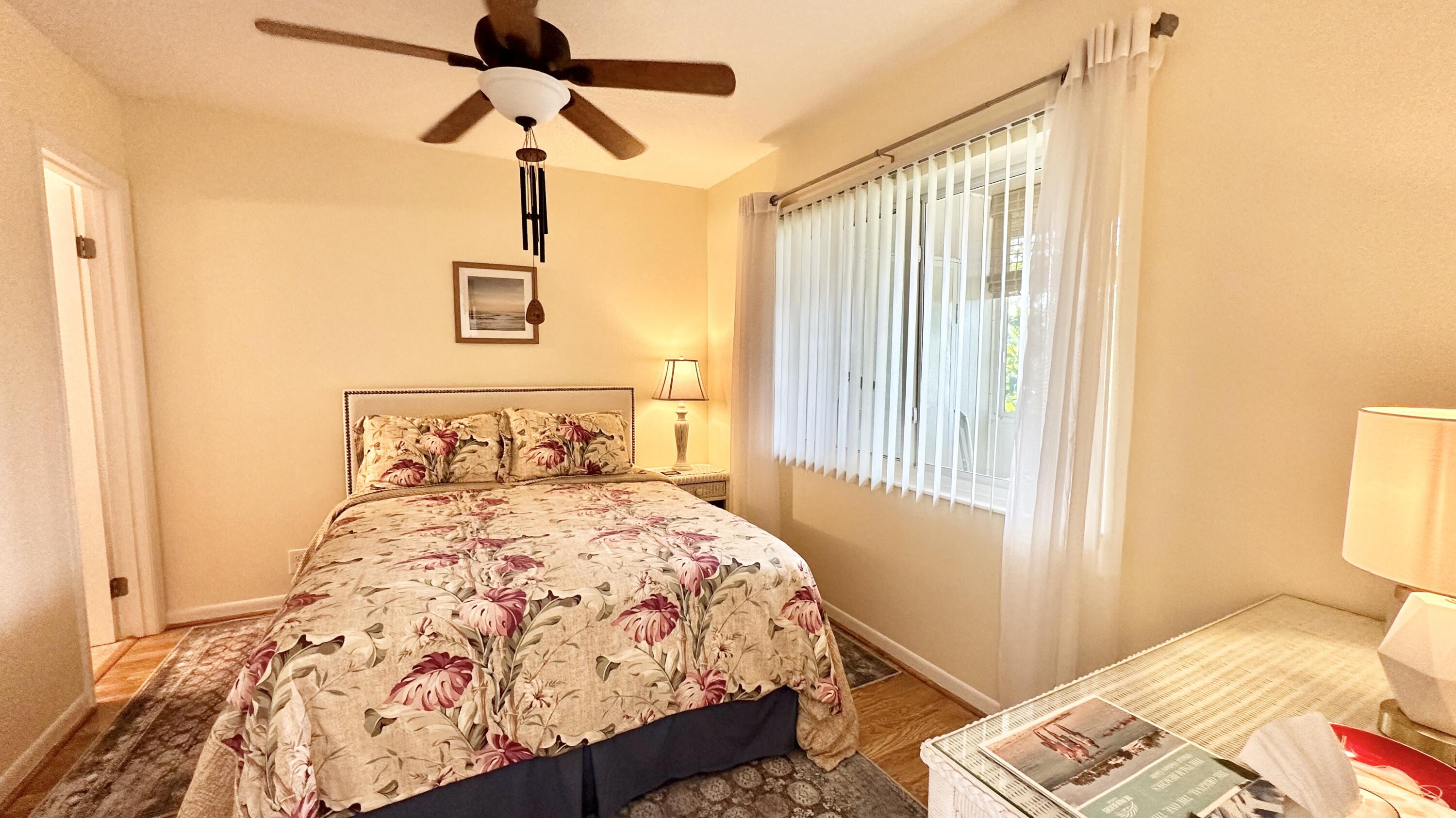 154 Lake Meryl Drive, Unit 257 West Palm Beach, FL 33411 - Photo 13 of 25 a bedroom with a bed and a window