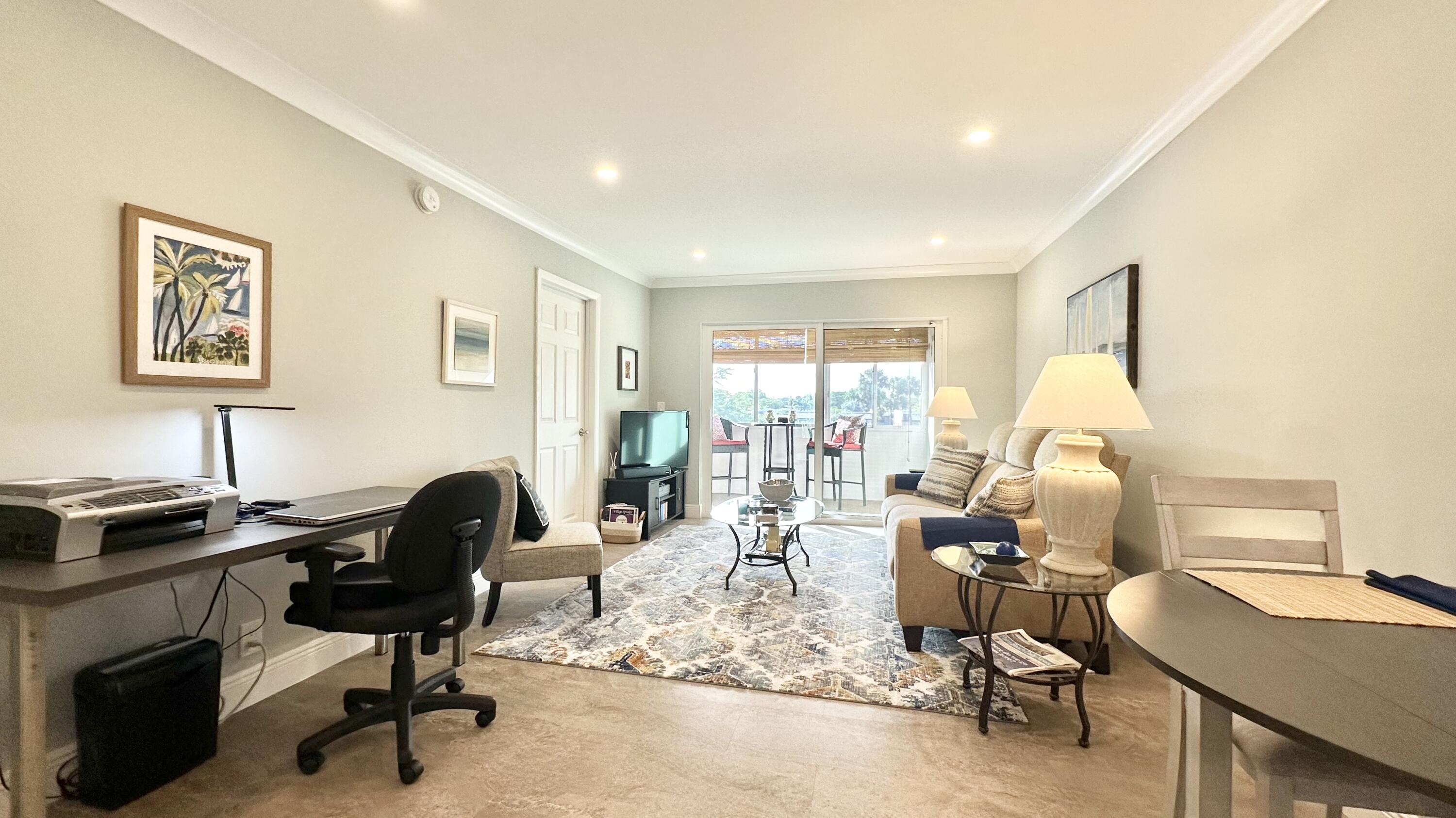 154 Lake Meryl Drive, Unit 257 West Palm Beach, FL 33411 - Photo 8 of 25 a view of a workspace with furniture and a window