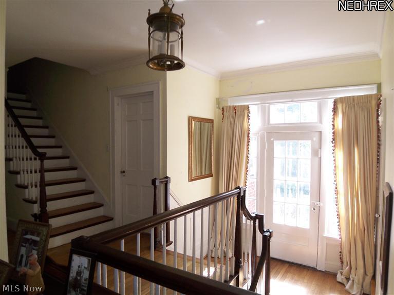 2746 Derbyshire Road Cleveland Heights, OH 44106 - Photo 15 of 24 BRIGHT & OPEN 2ND FLOOR HALL WITH VIEW OF STAIRWAY TO 3RD FLOOR