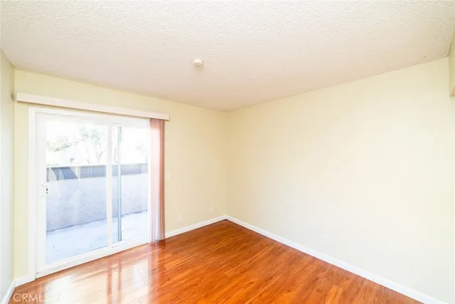 a view of hallway with wooden floor