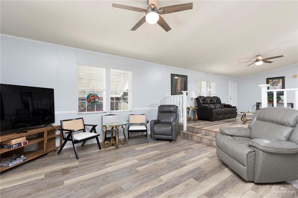 1034 Santa Maria Street Mercedes, TX 78570 - Photo 11 of 25 a living room with furniture and a flat screen tv