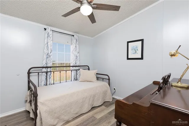 a bedroom with furniture and a window