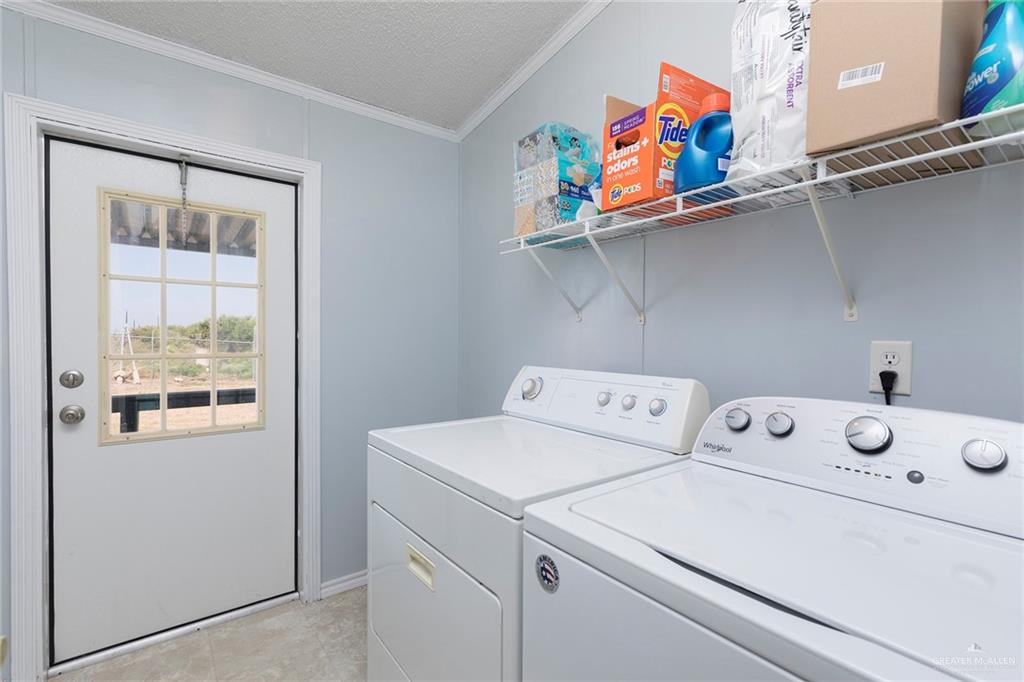 1034 Santa Maria Street Mercedes, TX 78570 - Photo 22 of 25 a utility room with dryer and washer