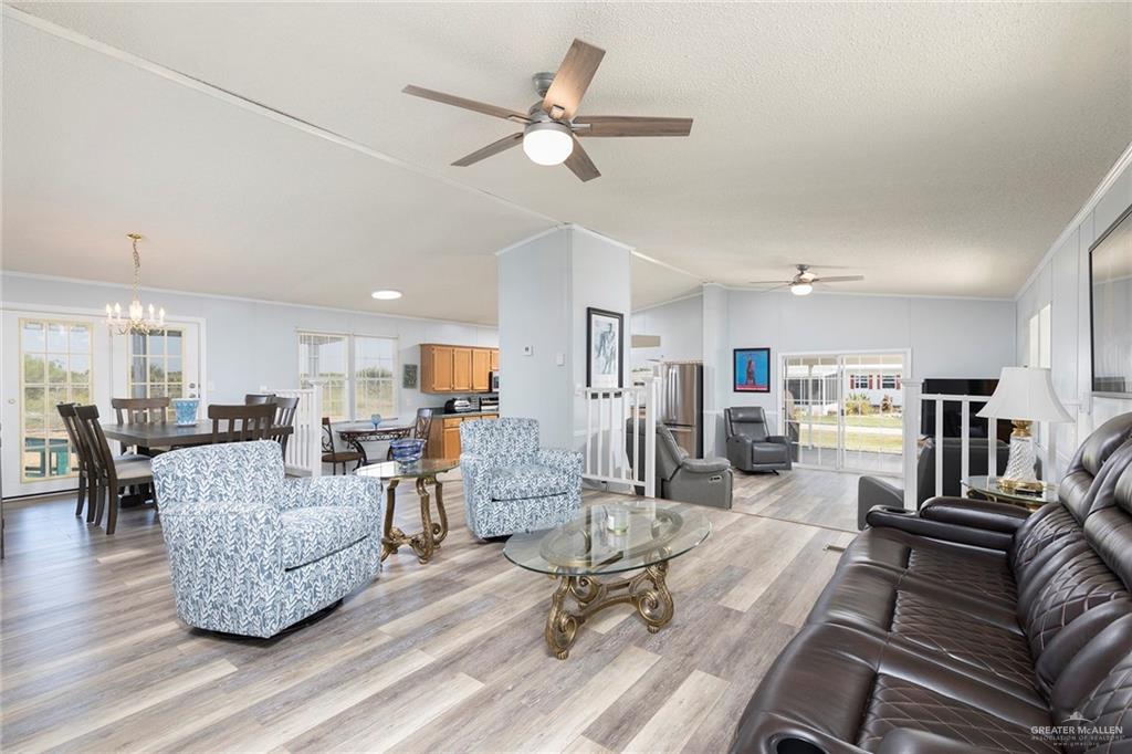 1034 Santa Maria Street Mercedes, TX 78570 - Photo 4 of 25 a living room with furniture and kitchen view