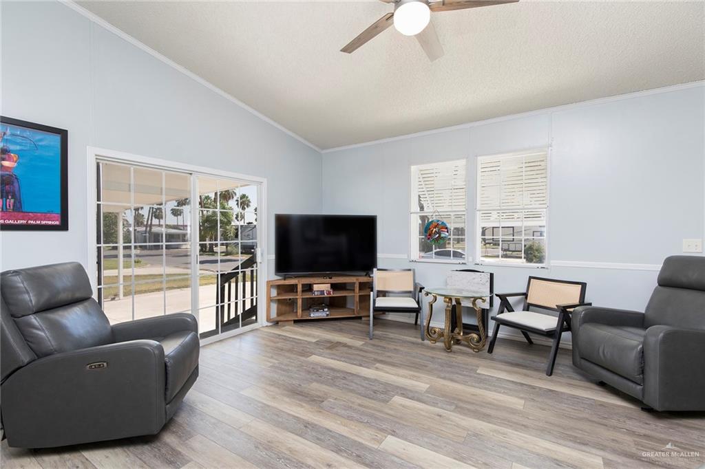 1034 Santa Maria Street Mercedes, TX 78570 - Photo 9 of 25 a living room with furniture and a flat screen tv