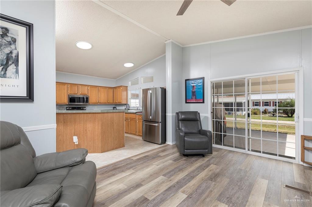 1034 Santa Maria Street Mercedes, TX 78570 - Photo 10 of 25 a living room with furniture and a large window