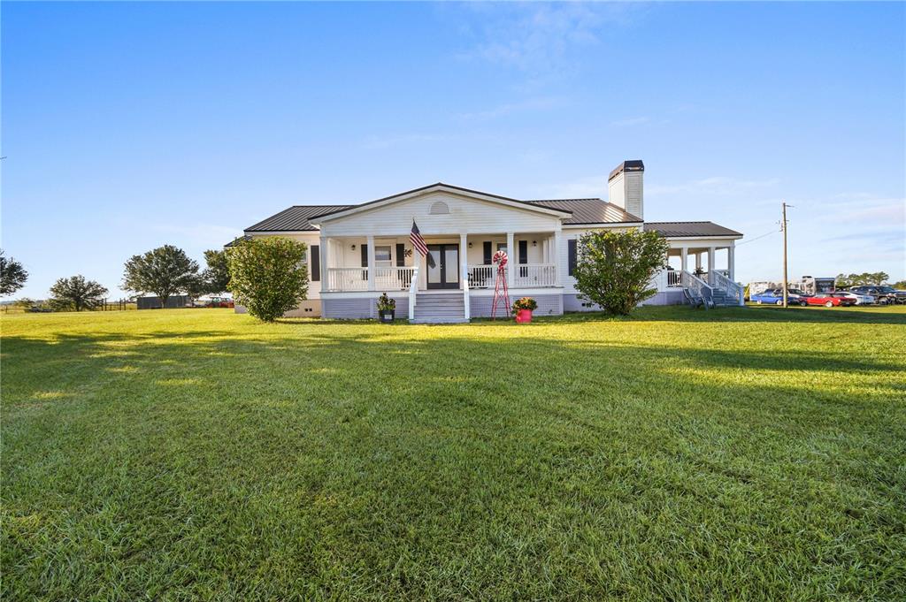 10807 Northwest Lily County Line Road Ona, FL 33865 - Photo 29 of 91 a view of a house with a yard and sitting area