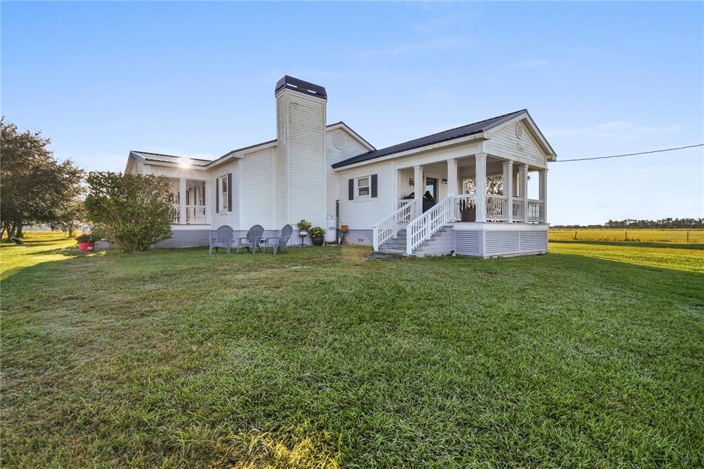 10807 Northwest Lily County Line Road Ona, FL 33865 - Photo 30 of 91 a front view of house with garden