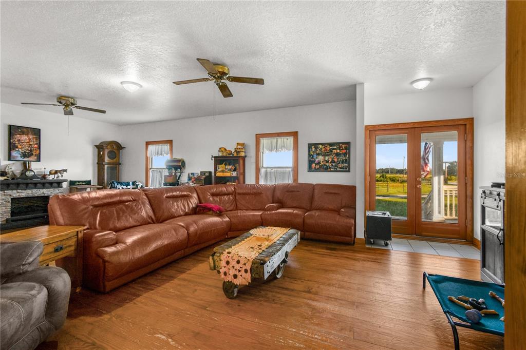 10807 Northwest Lily County Line Road Ona, FL 33865 - Photo 38 of 91 a living room with furniture and a large window