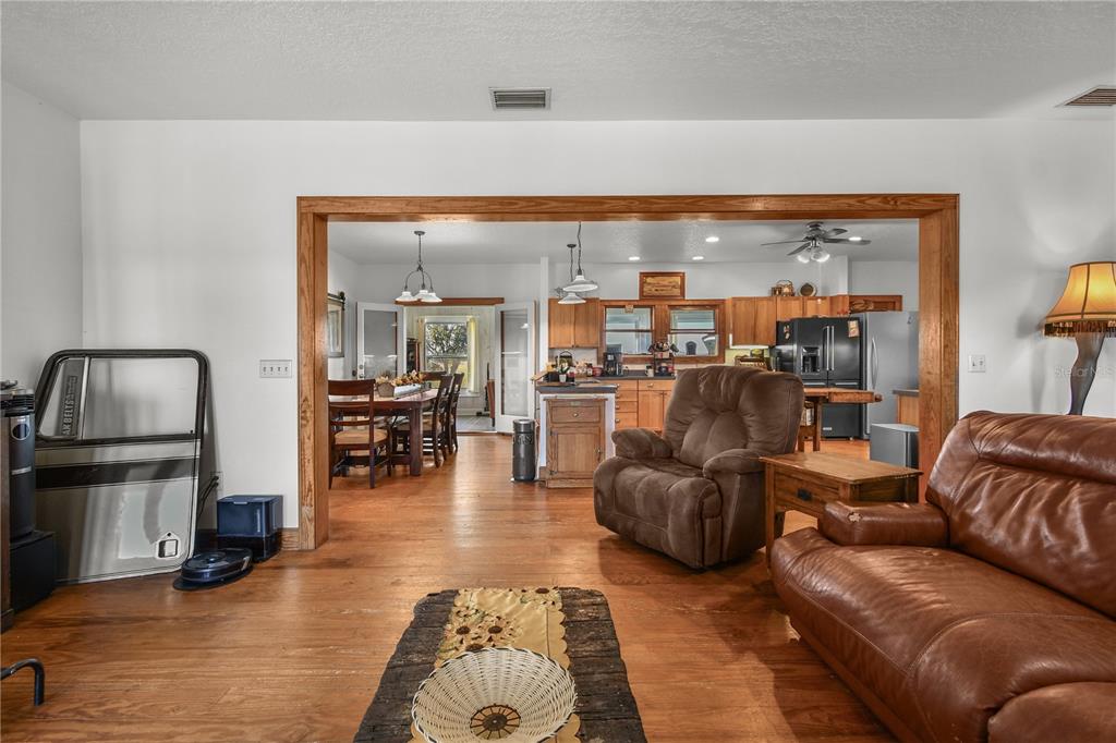 10807 Northwest Lily County Line Road Ona, FL 33865 - Photo 41 of 91 a living room with furniture and a view of kitchen