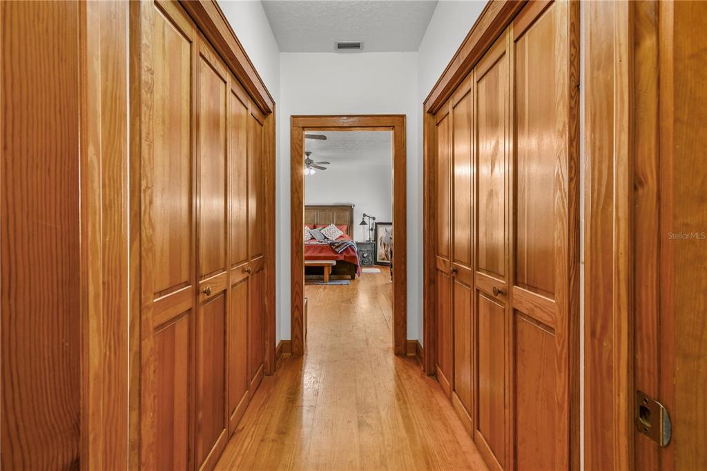 10807 Northwest Lily County Line Road Ona, FL 33865 - Photo 60 of 91 a view of a hallway with wooden floor and staircase