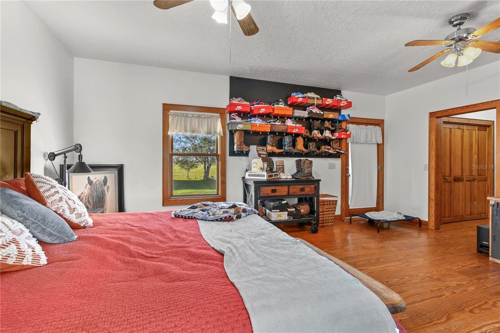 10807 Northwest Lily County Line Road Ona, FL 33865 - Photo 62 of 91 a bedroom with bed and a large window
