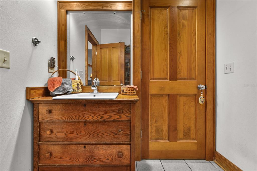 10807 Northwest Lily County Line Road Ona, FL 33865 - Photo 65 of 91 a bathroom with a sink vanity and a mirror