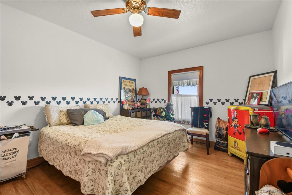 10807 Northwest Lily County Line Road Ona, FL 33865 - Photo 67 of 91 a bedroom with bed and wooden floor