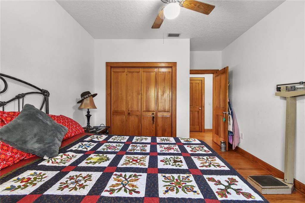 10807 Northwest Lily County Line Road Ona, FL 33865 - Photo 72 of 91 a bedroom with a bed and a window