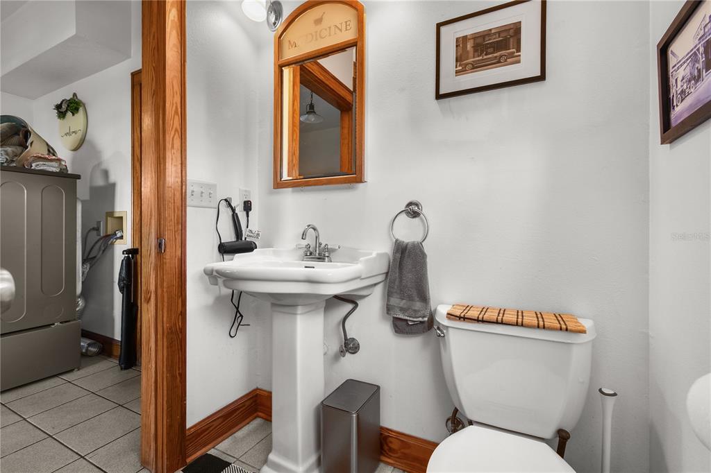 10807 Northwest Lily County Line Road Ona, FL 33865 - Photo 74 of 91 a bathroom with a toilet sink and mirror