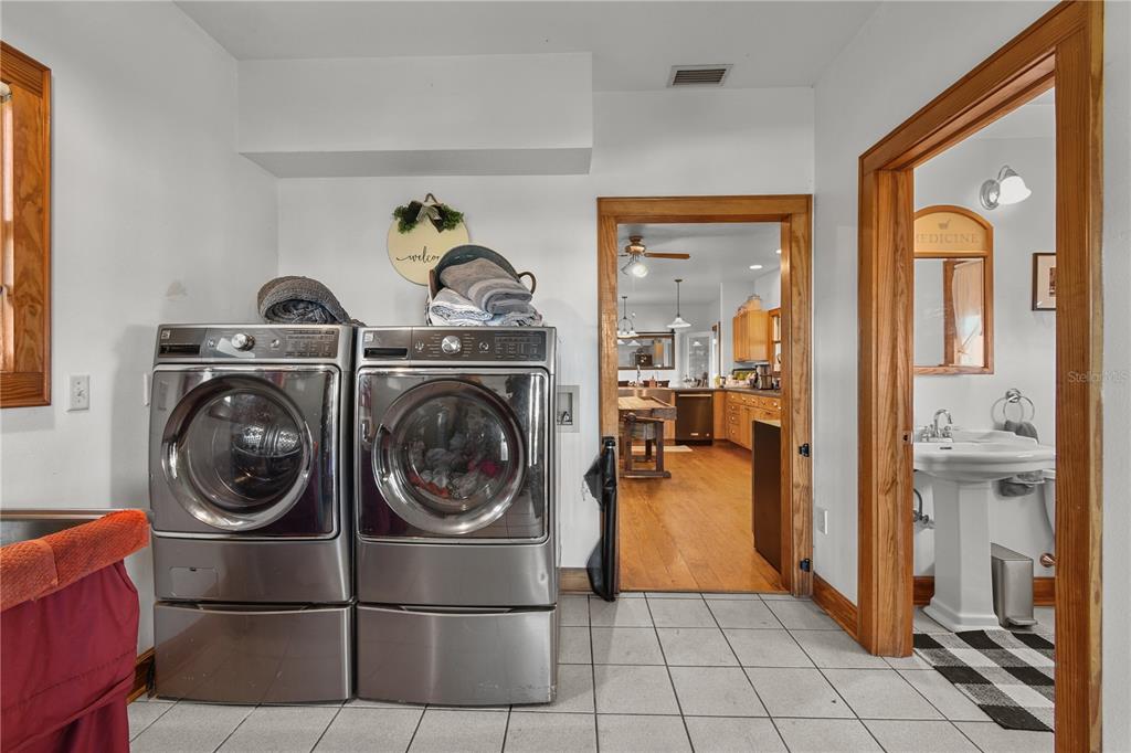 10807 Northwest Lily County Line Road Ona, FL 33865 - Photo 75 of 91 a view of a storage & utility room with washer and dryer