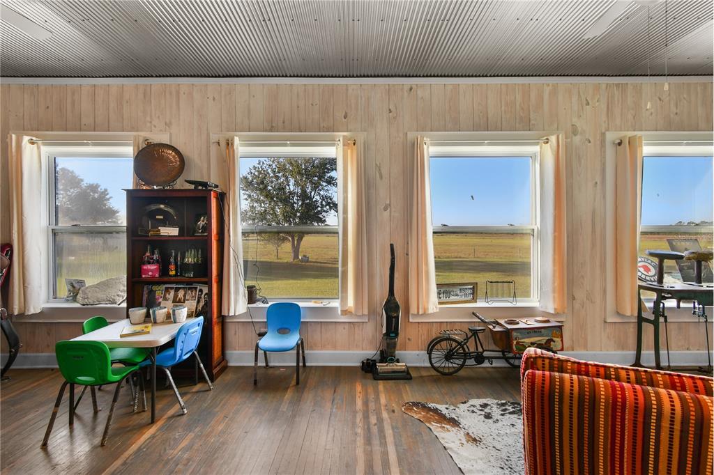 10807 Northwest Lily County Line Road Ona, FL 33865 - Photo 79 of 91 a living room with furniture and a large window
