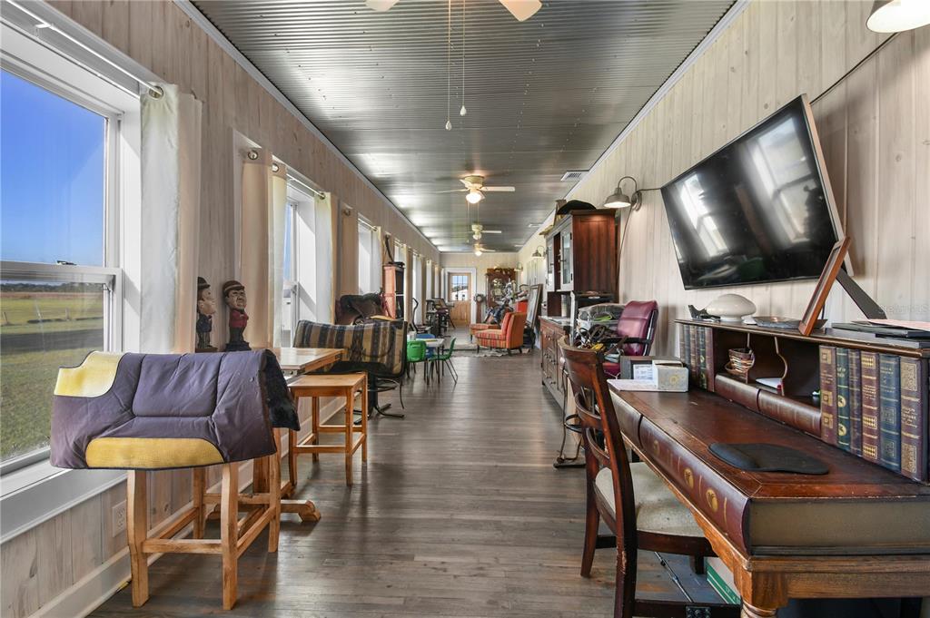 10807 Northwest Lily County Line Road Ona, FL 33865 - Photo 82 of 91 a living room with furniture a flat screen tv and wooden floor