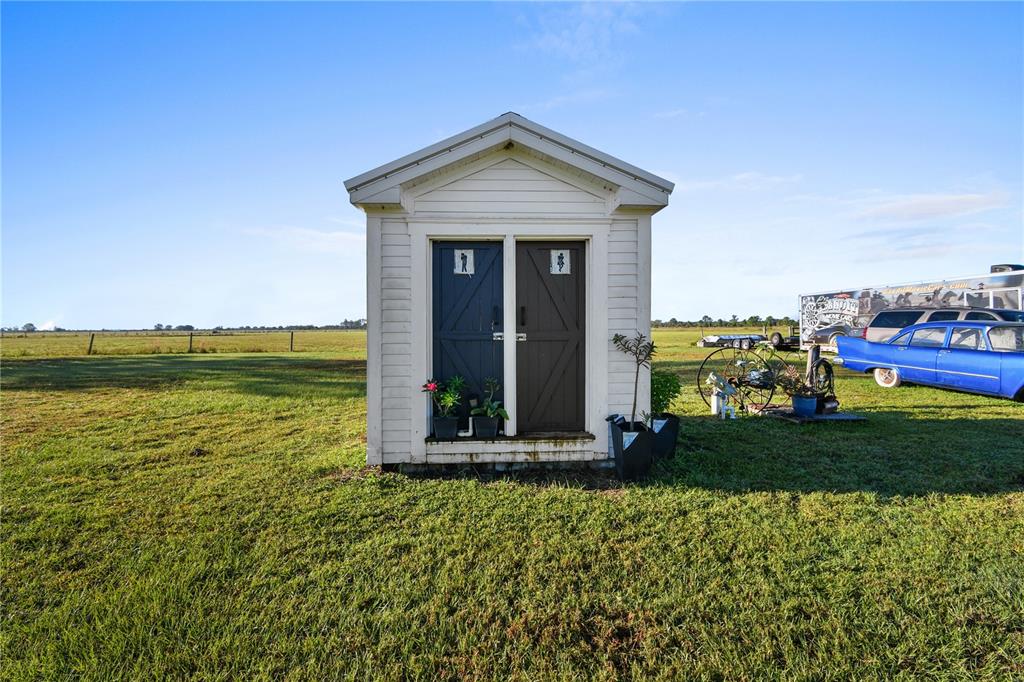 10807 Northwest Lily County Line Road Ona, FL 33865 - Photo 91 of 91 a front view of a house with a yard