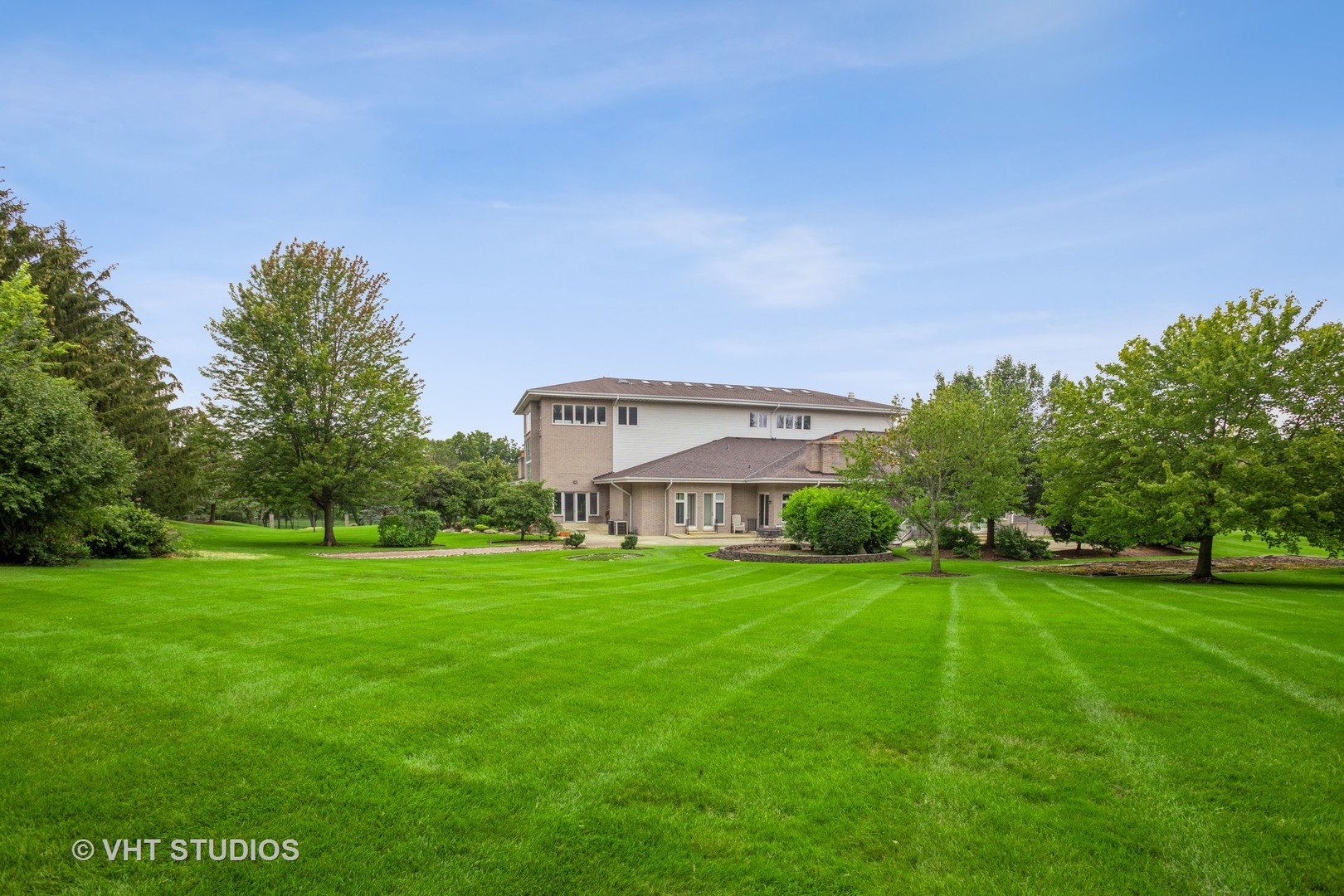 33W859 Fletcher Road Wayne, IL 60174 - Photo 83 of 110 a view of a big house with a big yard and large trees