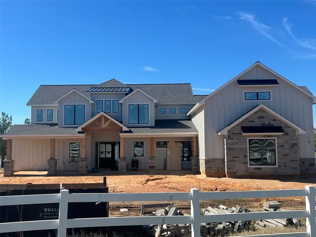 a front view of a residential apartment building with a yard