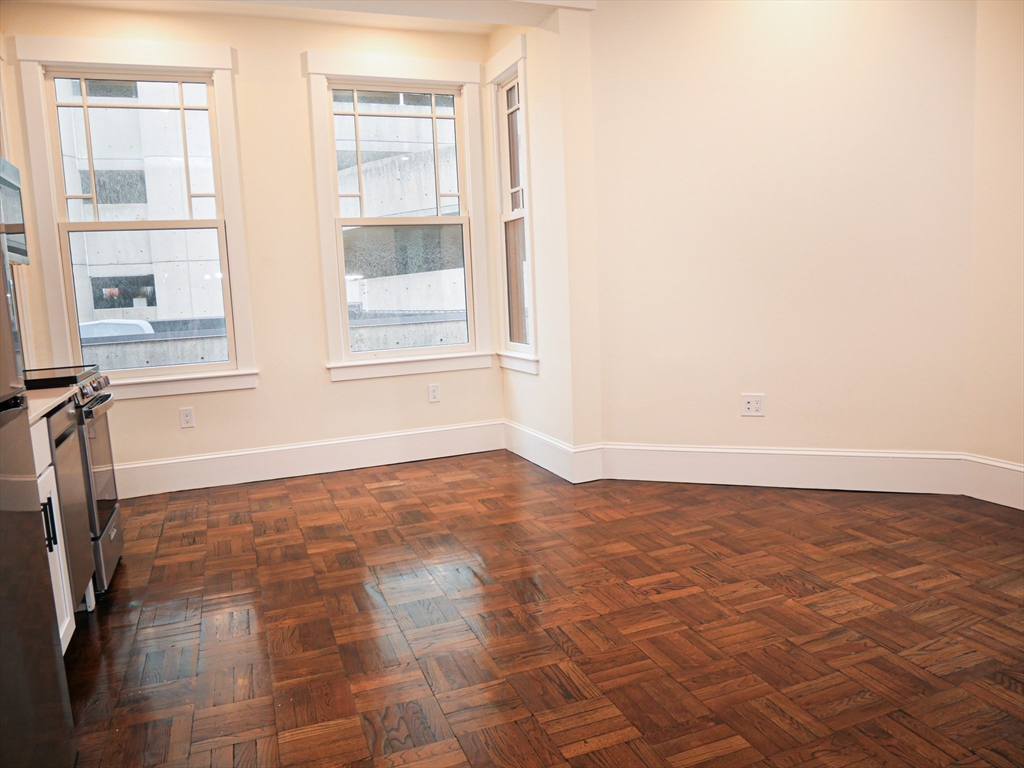 261 West Newton Street, Unit 2 Boston, MA 02116 - Photo 3 of 7 a view of an empty room with a window