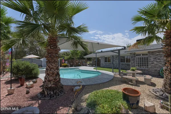 a view of a swimming pool with a patio