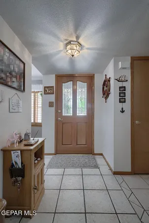a view of a house with garden and a sitting area