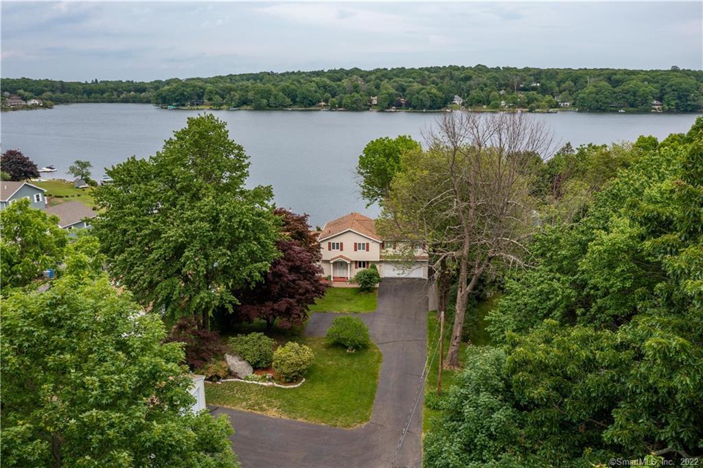 a view of a lake with houses in the back