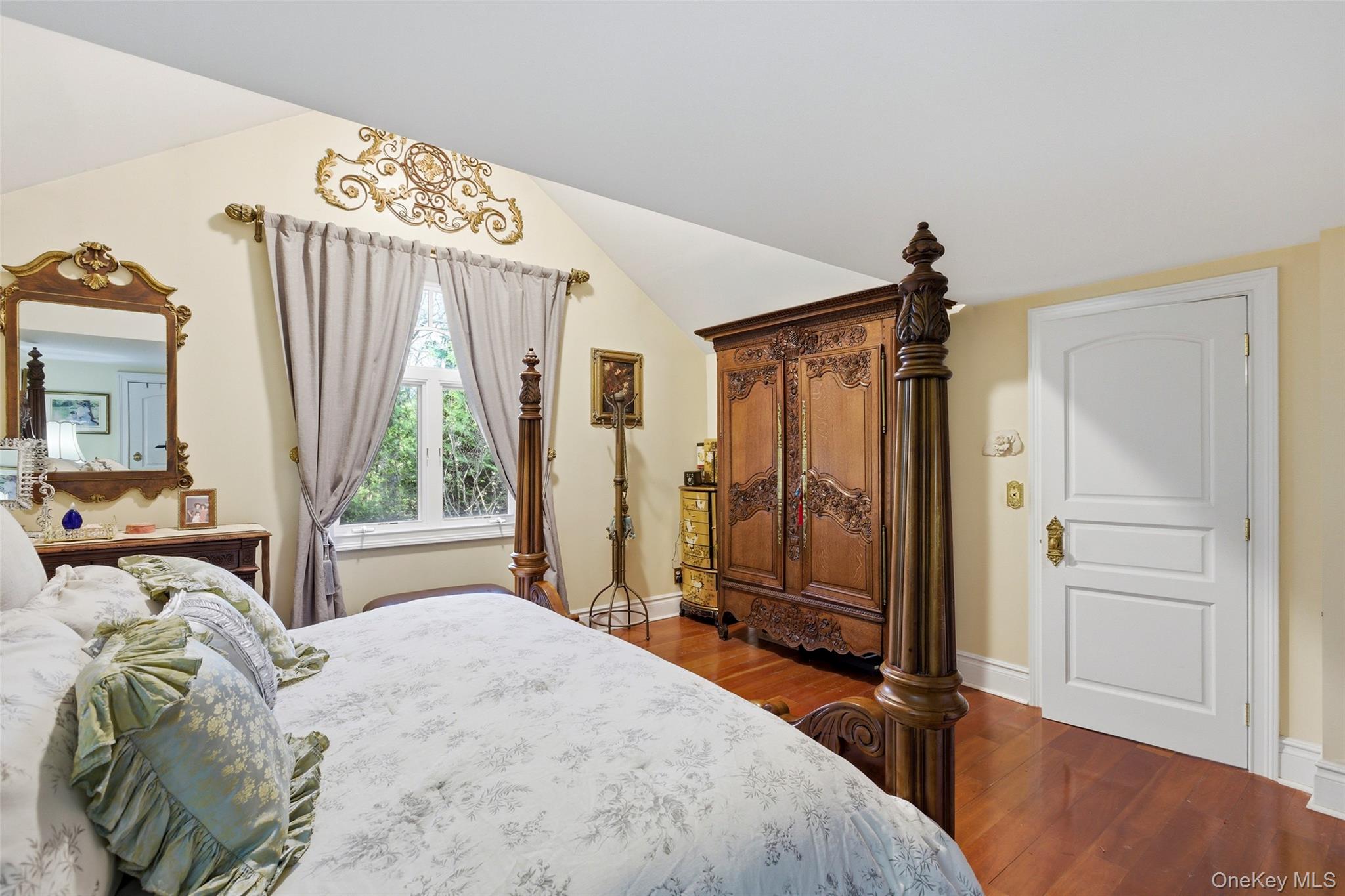 31 West Meadow Road Setauket, NY 11733 - Photo 12 of 28 a spacious bedroom with a bed and a dresser next to a window