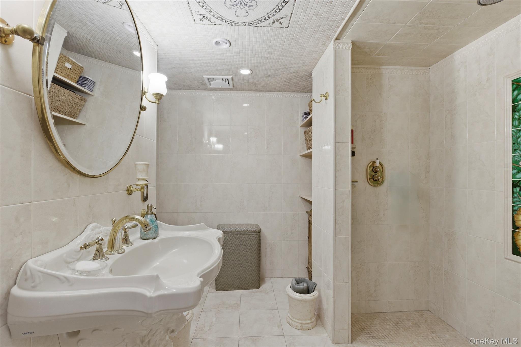 31 West Meadow Road Setauket, NY 11733 - Photo 13 of 28 a bathroom with a sink toilet and shower