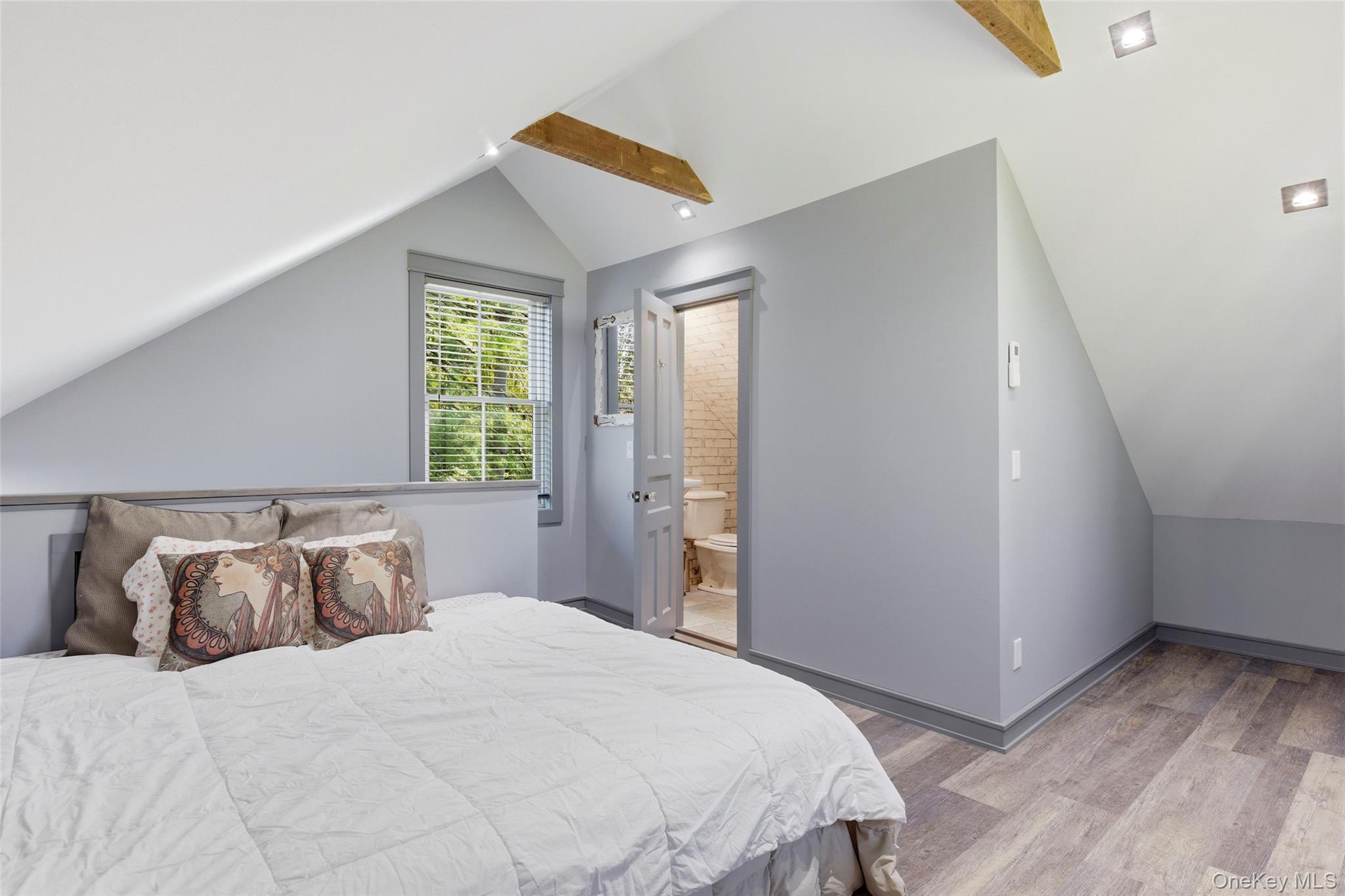 31 West Meadow Road Setauket, NY 11733 - Photo 21 of 28 a bedroom with a bed and window