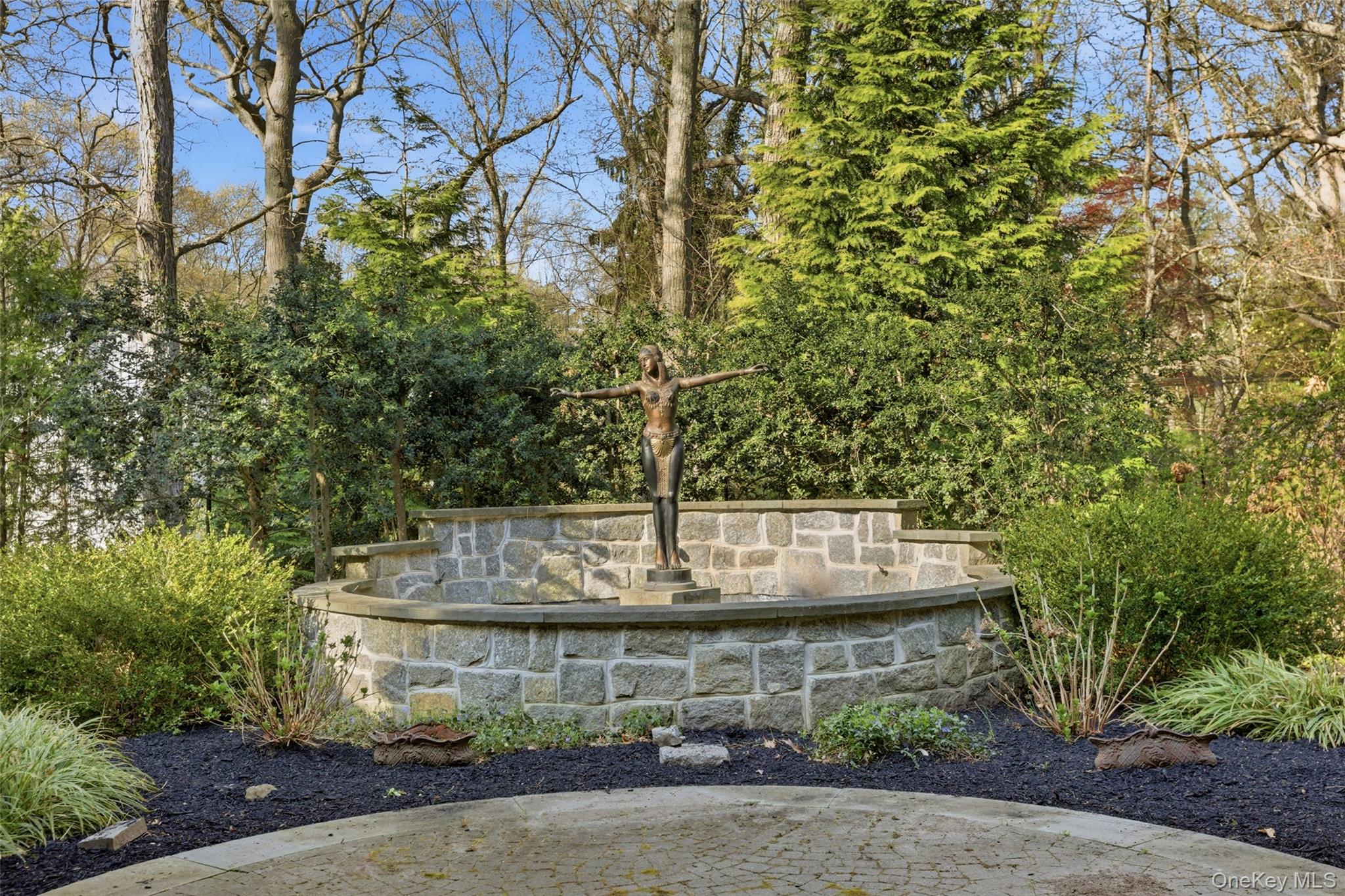 31 West Meadow Road Setauket, NY 11733 - Photo 22 of 28 a view of fountain with tree in the background