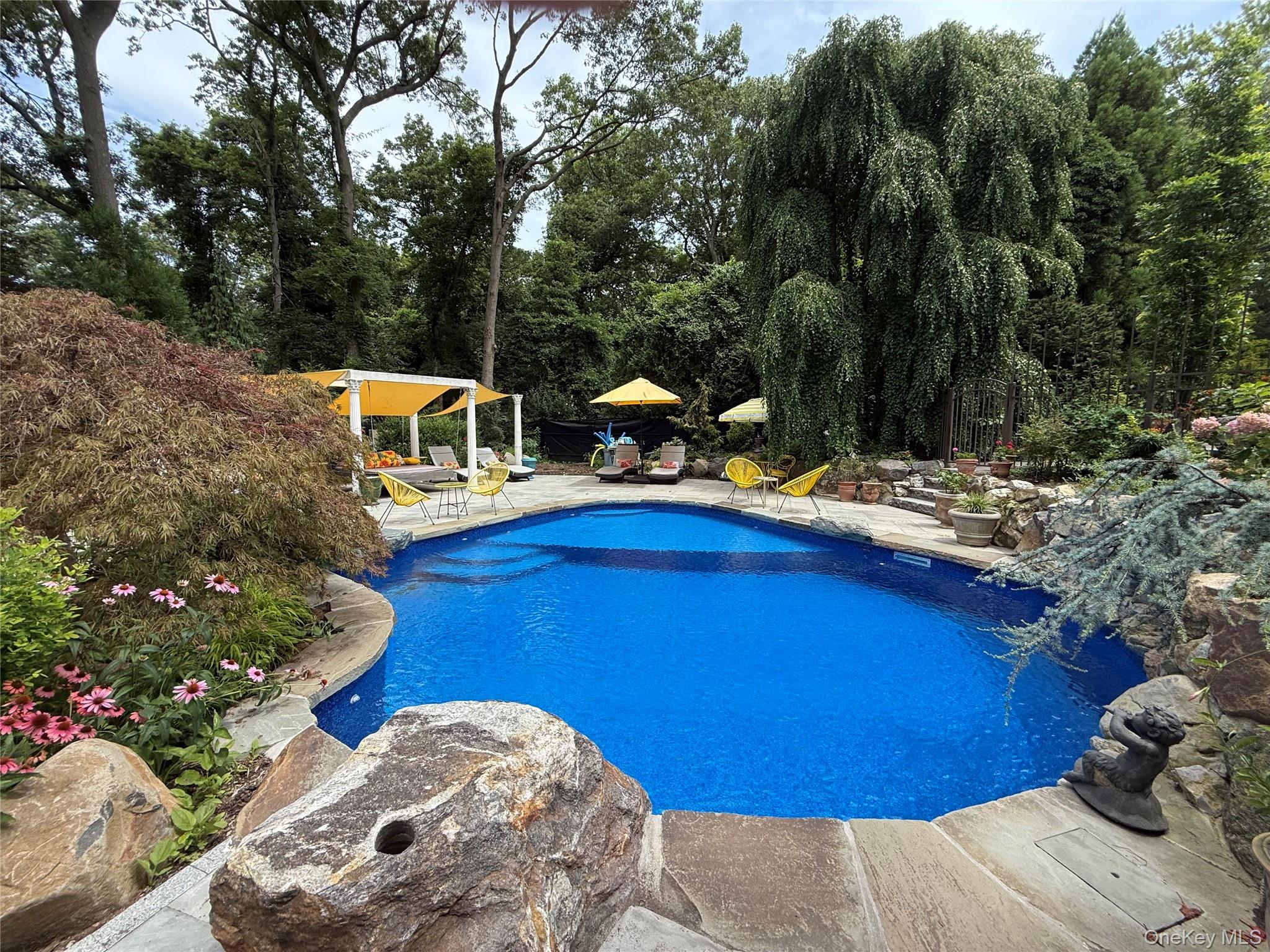 31 West Meadow Road Setauket, NY 11733 - Photo 23 of 28 a view of a chairs with an outdoor space