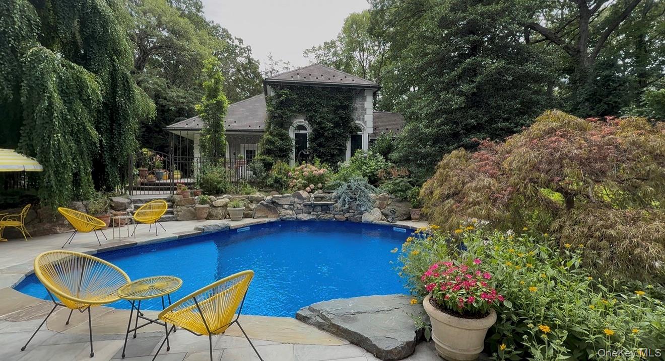 31 West Meadow Road Setauket, NY 11733 - Photo 25 of 28 a view of a chairs and table in backyard