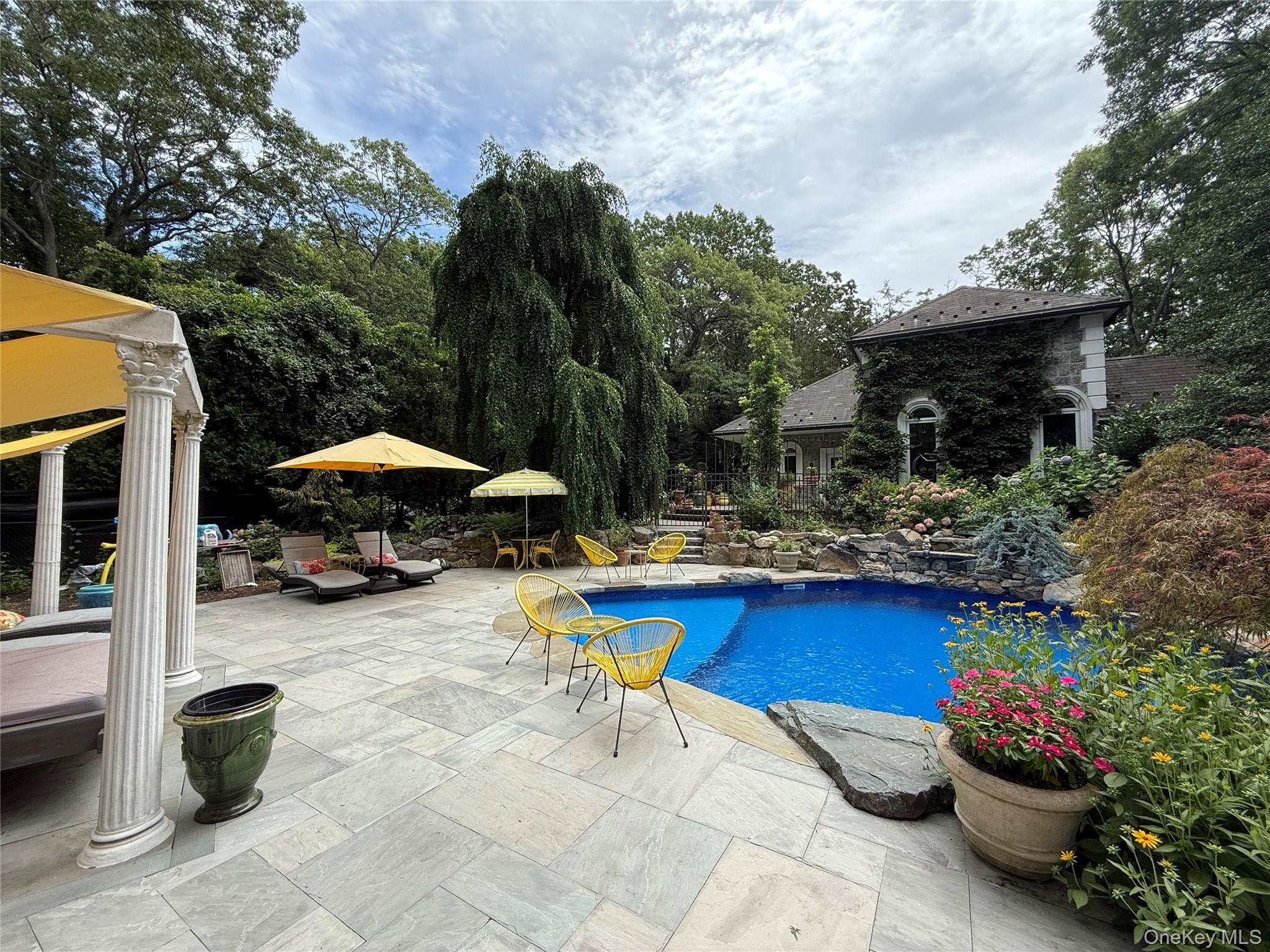 31 West Meadow Road Setauket, NY 11733 - Photo 26 of 28 a view of patio with chairs and tables