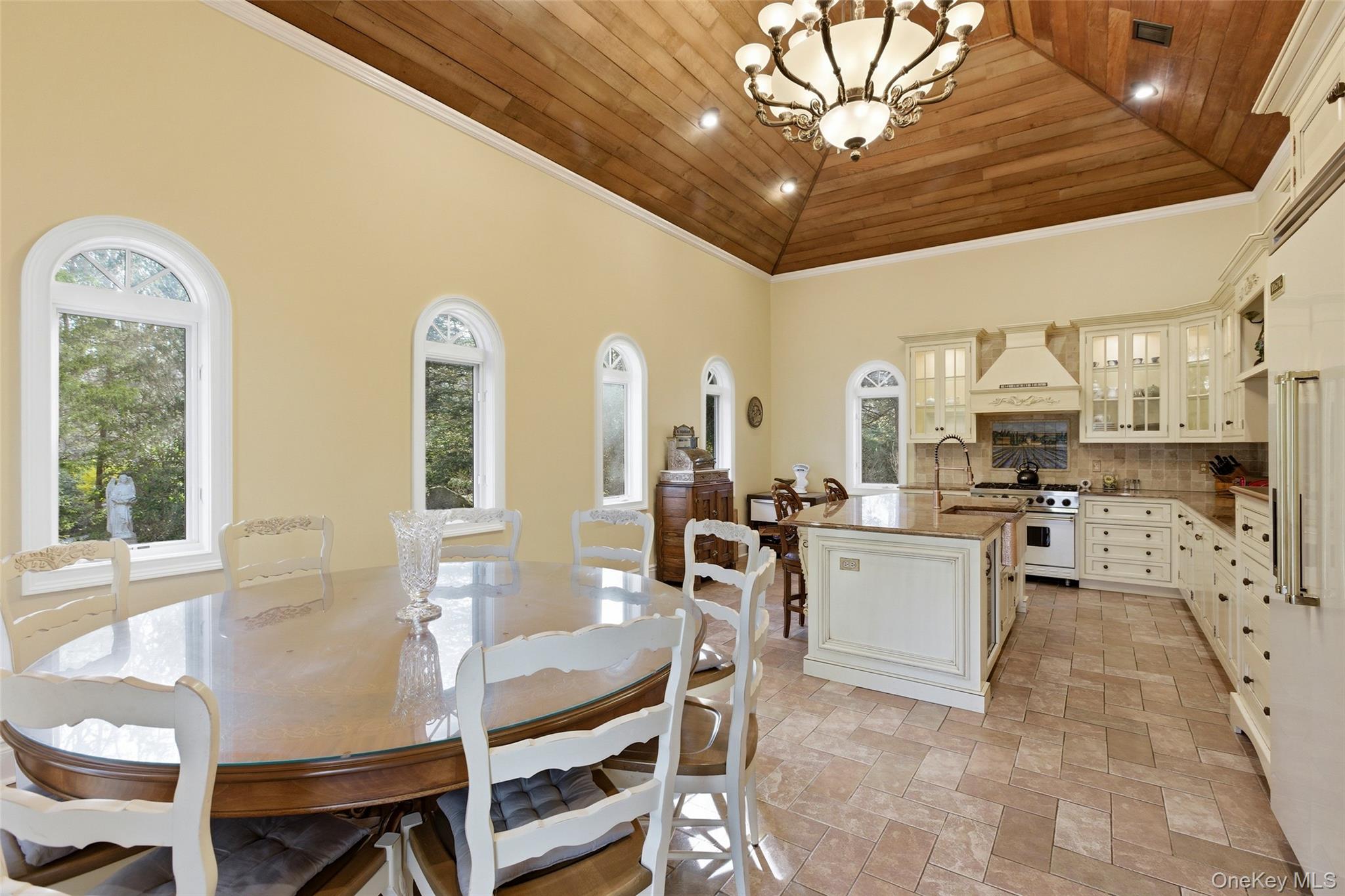 31 West Meadow Road Setauket, NY 11733 - Photo 3 of 28 a living room with furniture a dining table and chairs