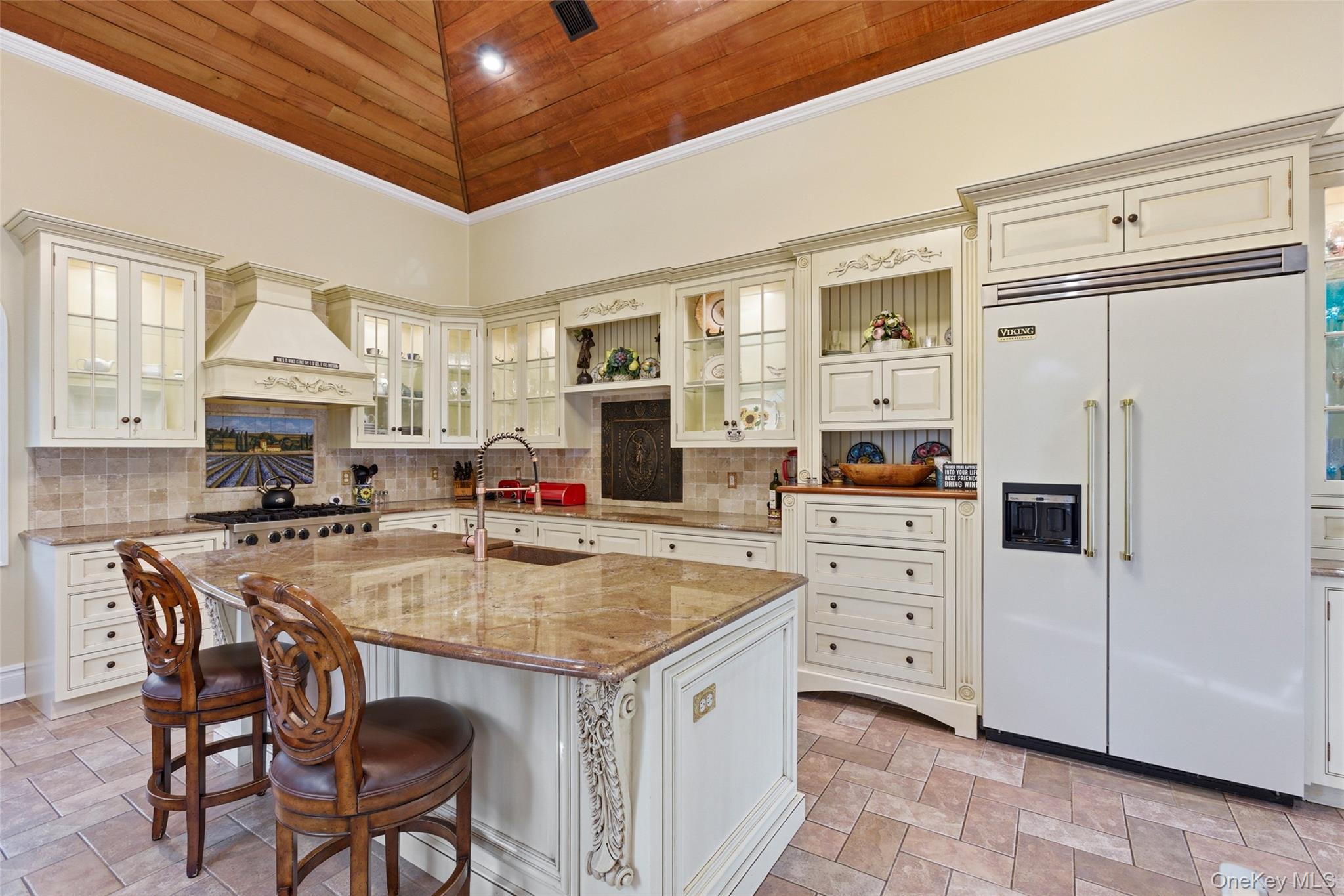 31 West Meadow Road Setauket, NY 11733 - Photo 4 of 28 a kitchen with stainless steel appliances kitchen island granite countertop a table chairs and a refrigerator