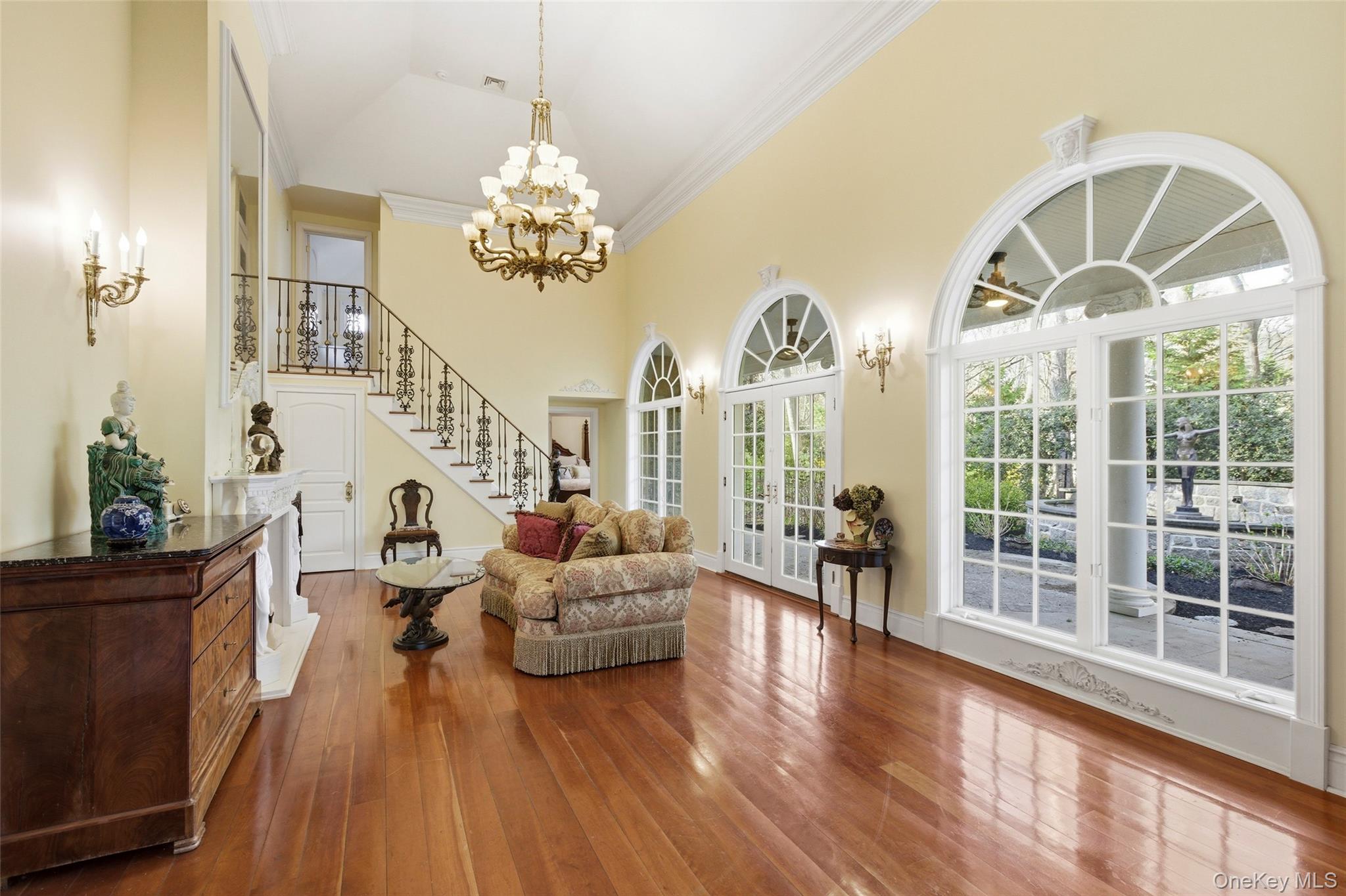 31 West Meadow Road Setauket, NY 11733 - Photo 7 of 28 a living room with fireplace furniture and a chandelier