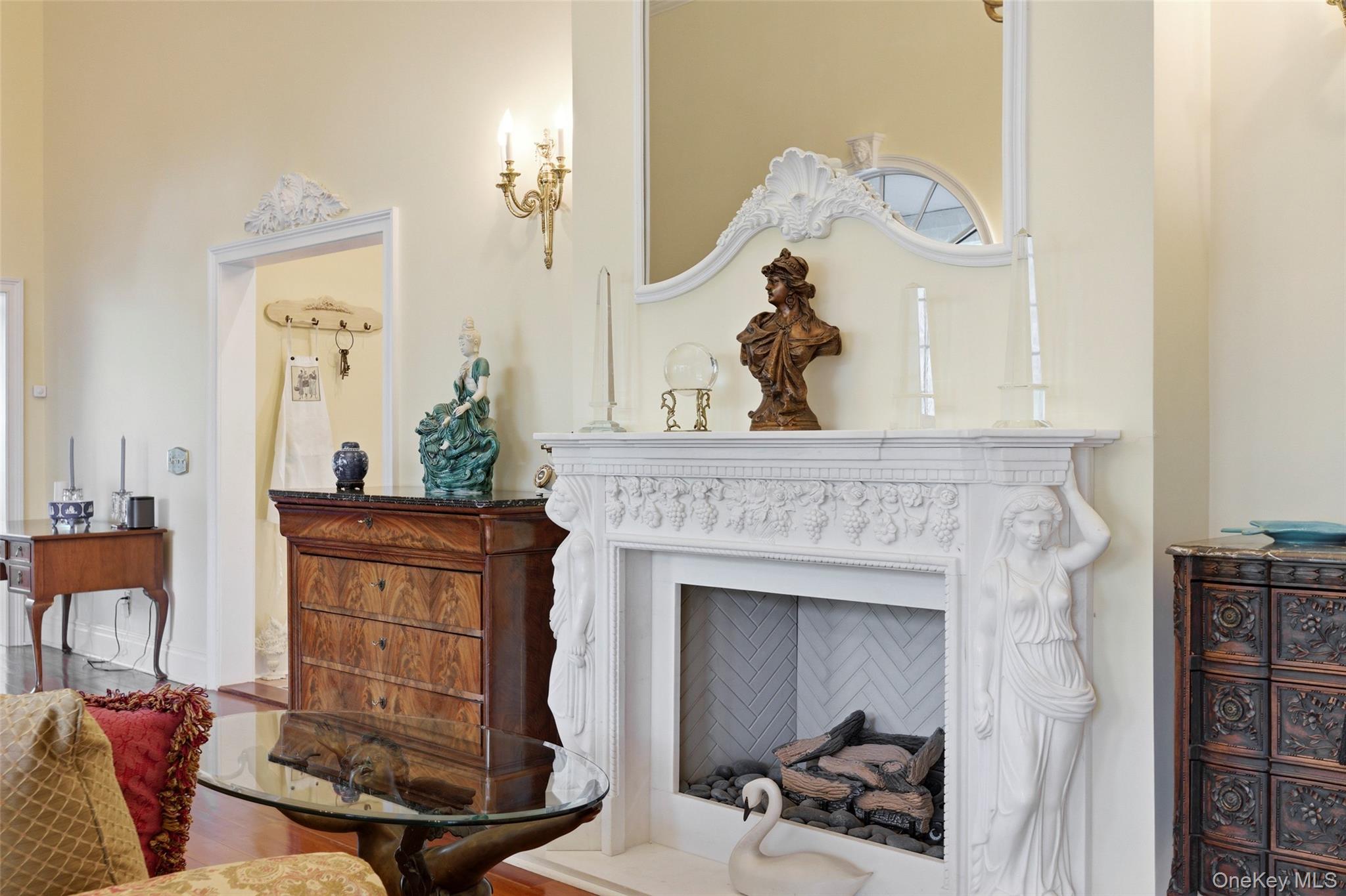 31 West Meadow Road Setauket, NY 11733 - Photo 9 of 28 a living room with furniture and a fireplace
